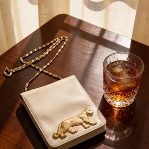 Vintage Dawli cream leather purse with gold chain strap and panther emblem